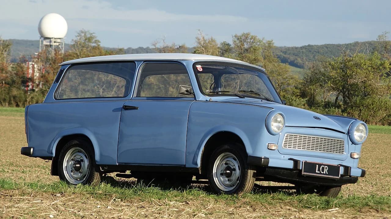 Powder-blue Trabant 601 Universal photographed in a field